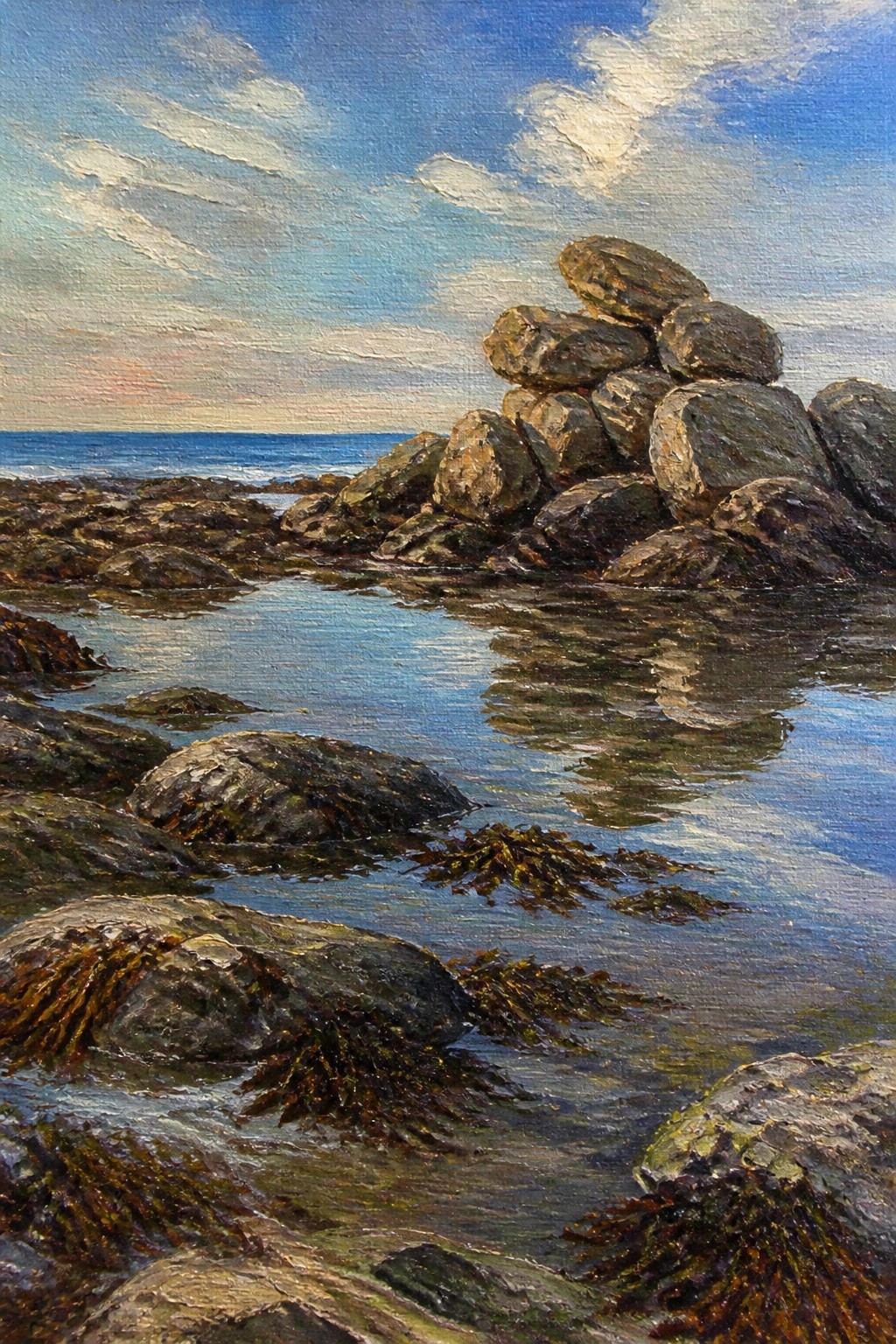 Rocky shoreline painting with stacked boulders, reflective tide pools, and seaweed under blue sky.