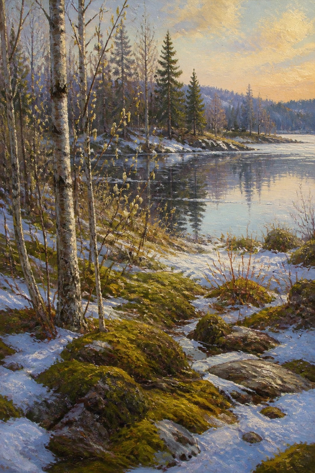 Snowy birch-lined riverbank with mossy rocks under a golden sunset sky.