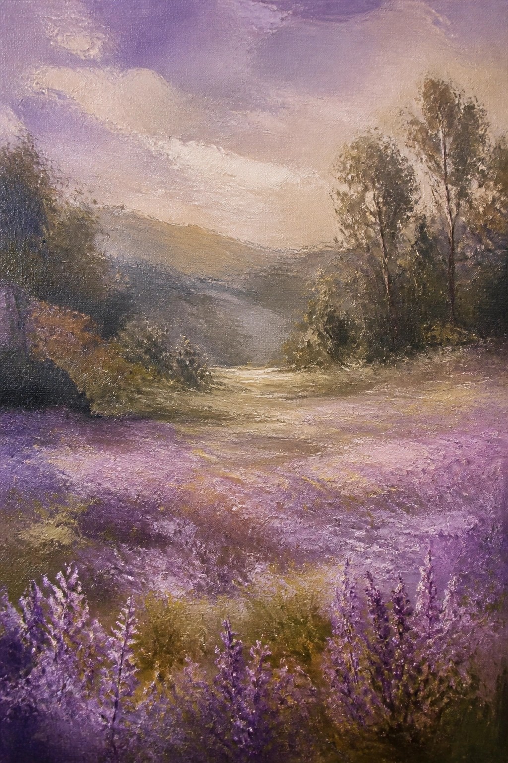 Lavender field with winding path, trees, and misty mountains under purple sky