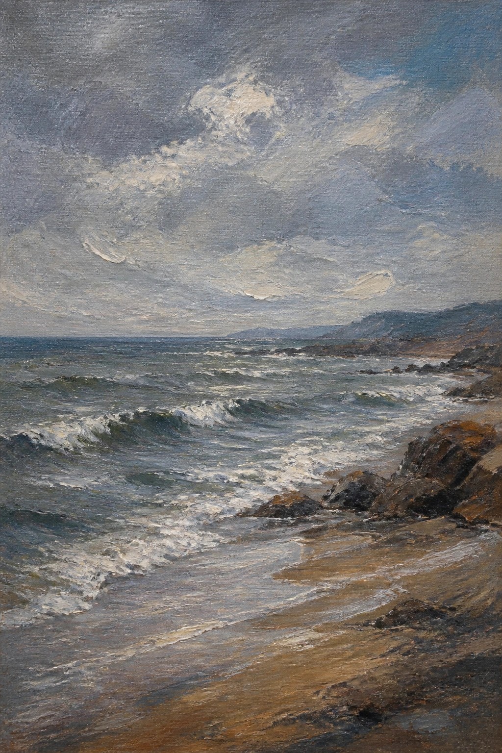 Turbulent waves crash on rocky sandy shore under stormy overcast sky with distant hills.
