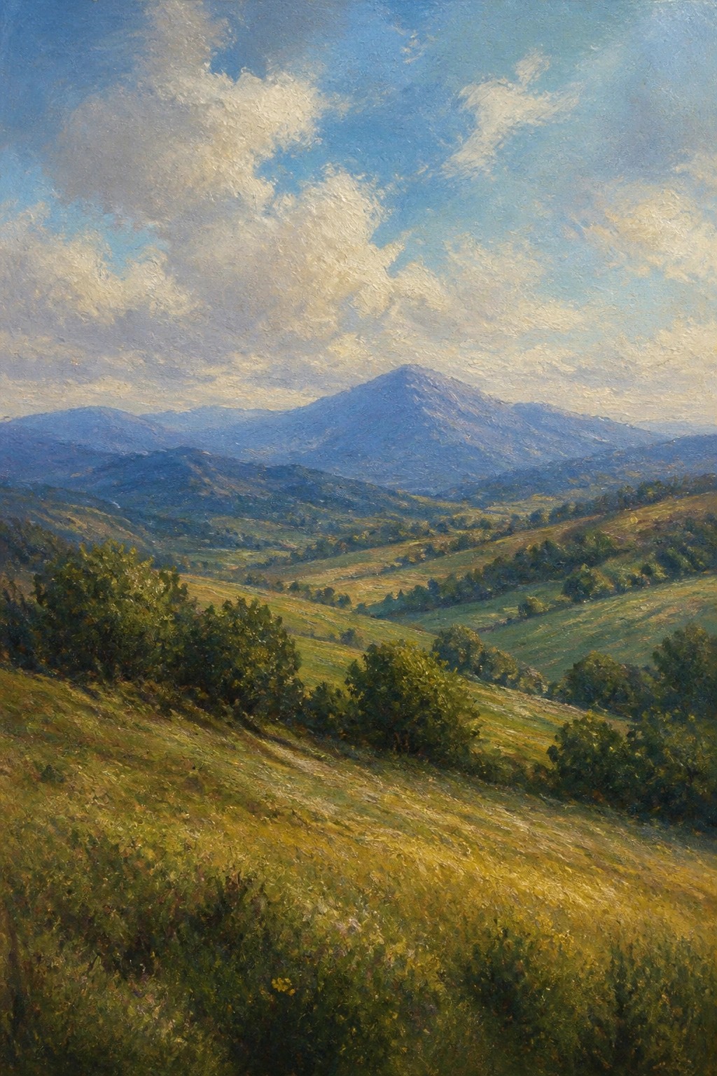 Rolling green hills and valleys with distant mountains under a cloudy blue sky
