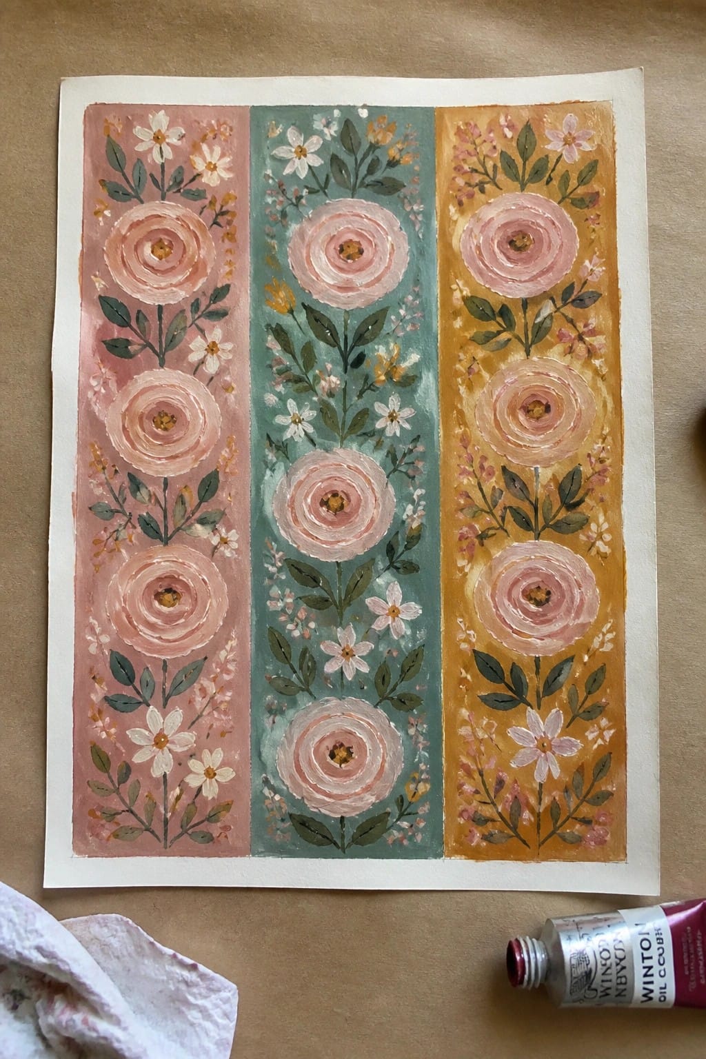 Three vertical panels of pink roses on pink, teal, and yellow floral backgrounds with paint tube