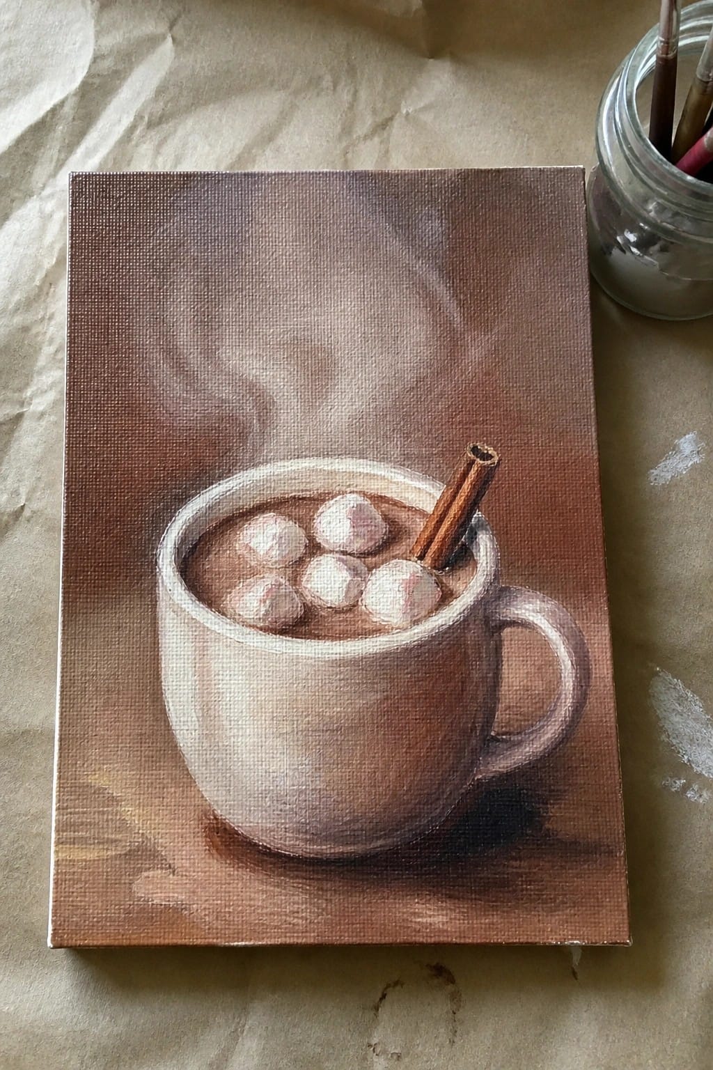 Realistic painting of steaming hot chocolate in a mug with marshmallows and cinnamon stick