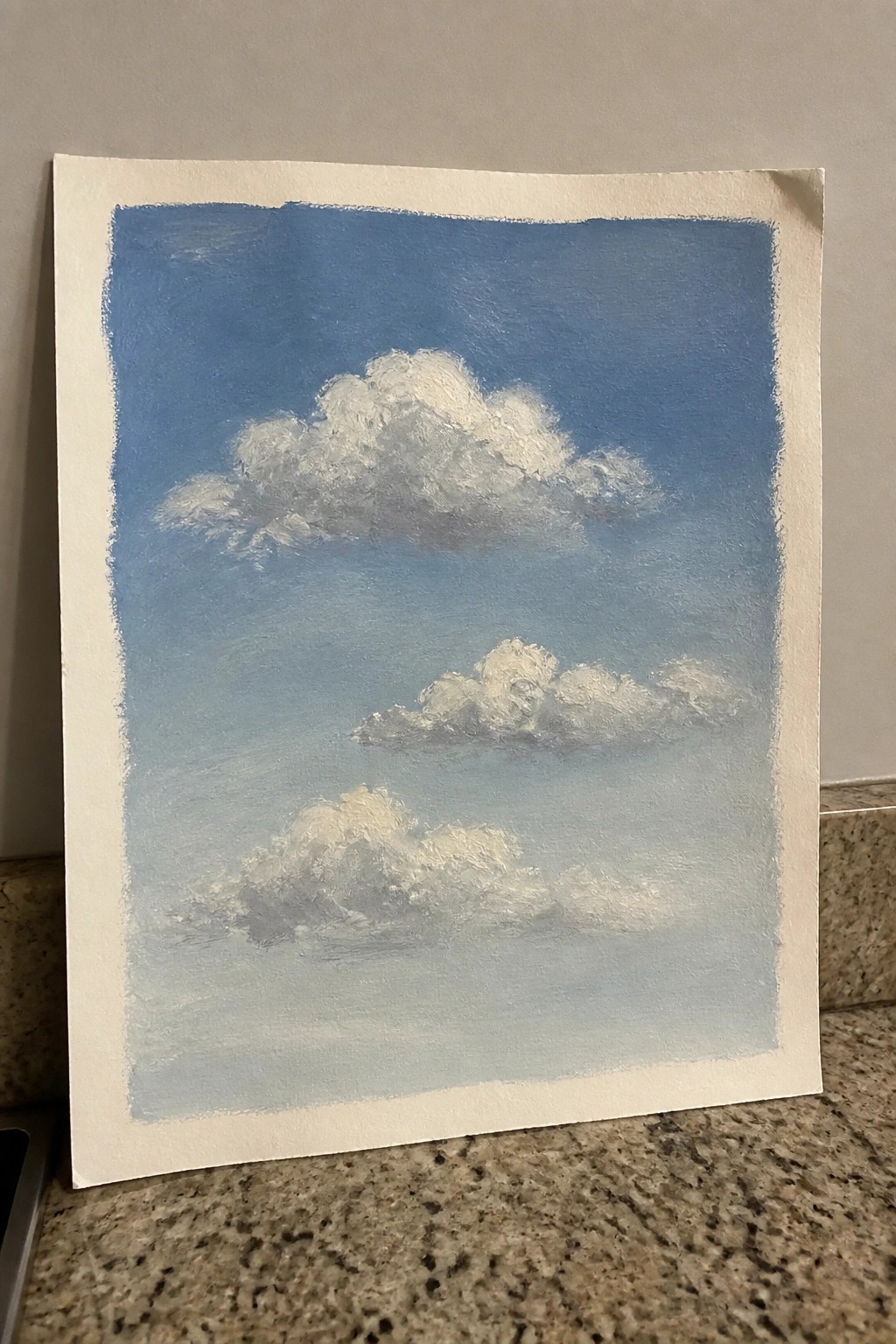 Painting of fluffy white clouds with gray tones in a blue sky with brushstrokes