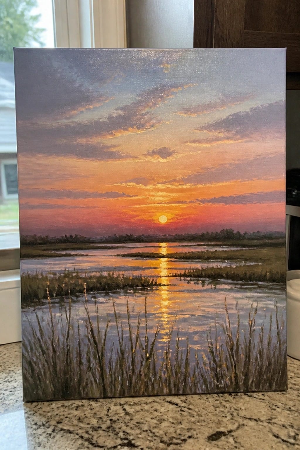 Canvas painting of orange sunset reflecting on marsh waters with grassy foreground