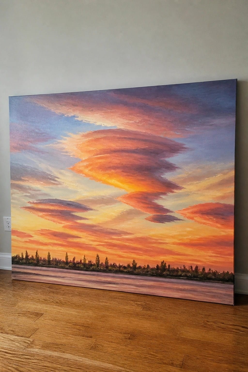 An oil painting of a sunset sky with layered orange and red clouds above a tree-lined horizon and open foreground.