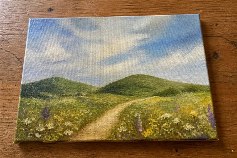 18 Easy Summer Oil Painting Ideas for Beginners Practicing Landscape Techniques Canvas painting of winding path through yellow-purple wildflowers with green hills and blue sky