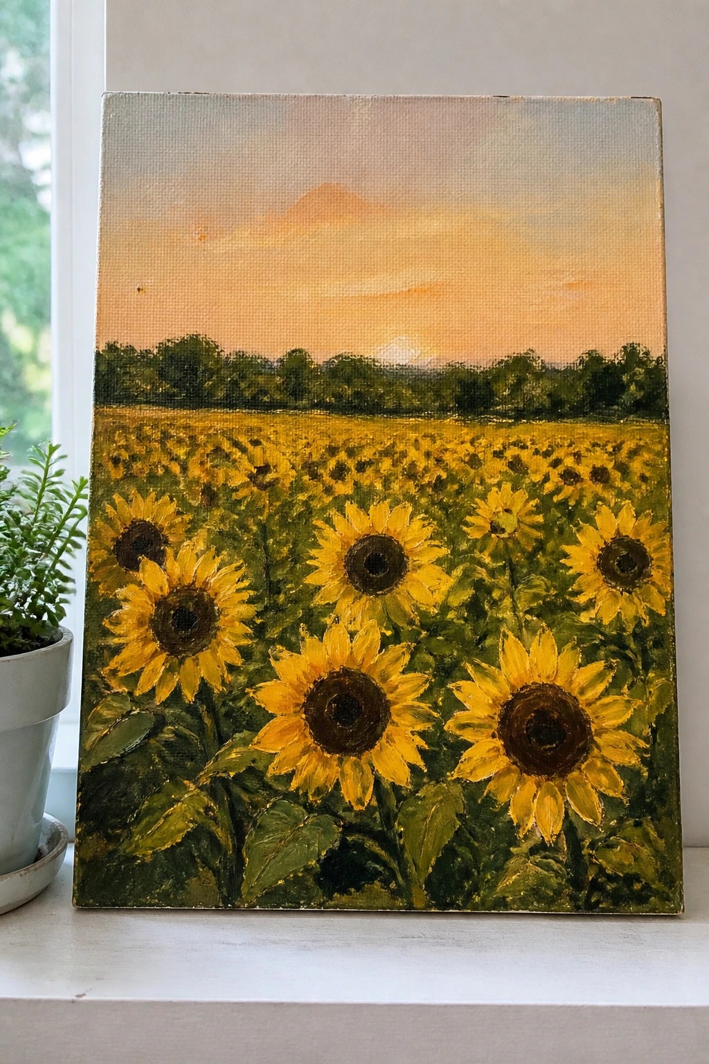 Canvas painting of sunflower field at sunset with yellow blooms and orange sky