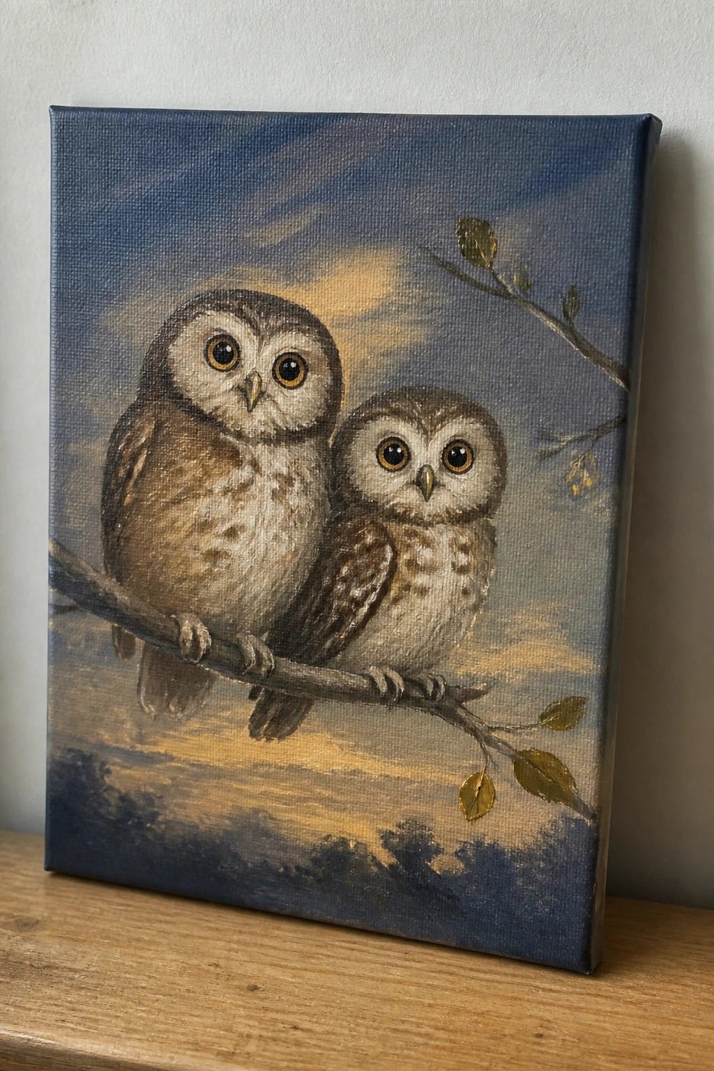 Two owls with large eyes perched on a branch against a blue and golden sky