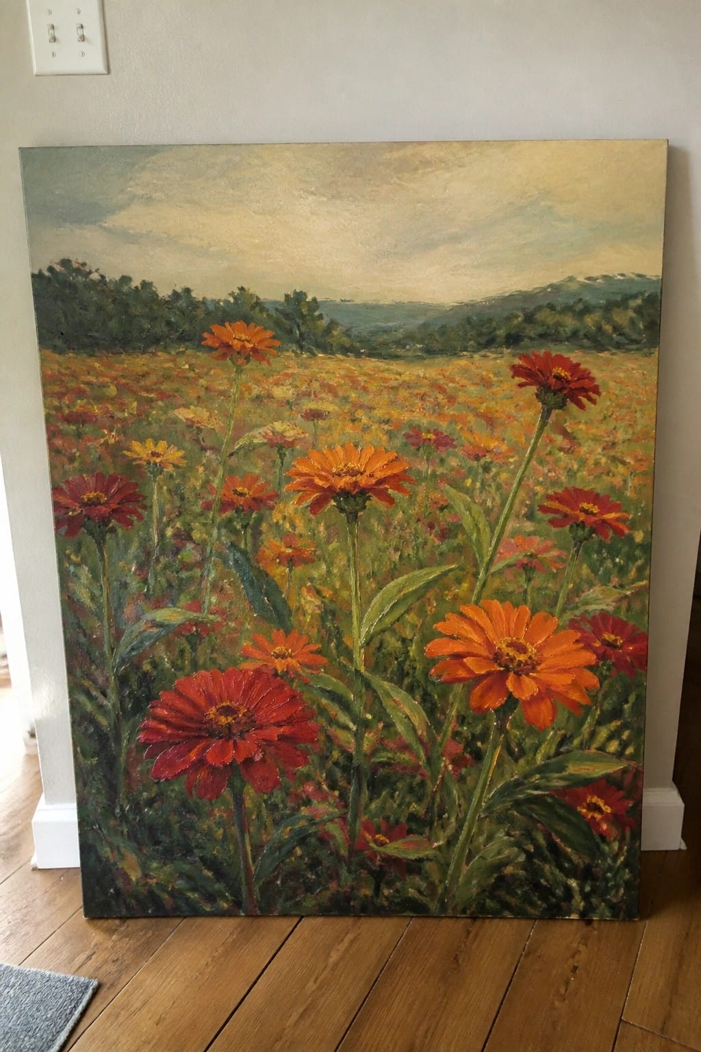 Vibrant oil painting of red and orange wildflowers in a meadow with distant hills