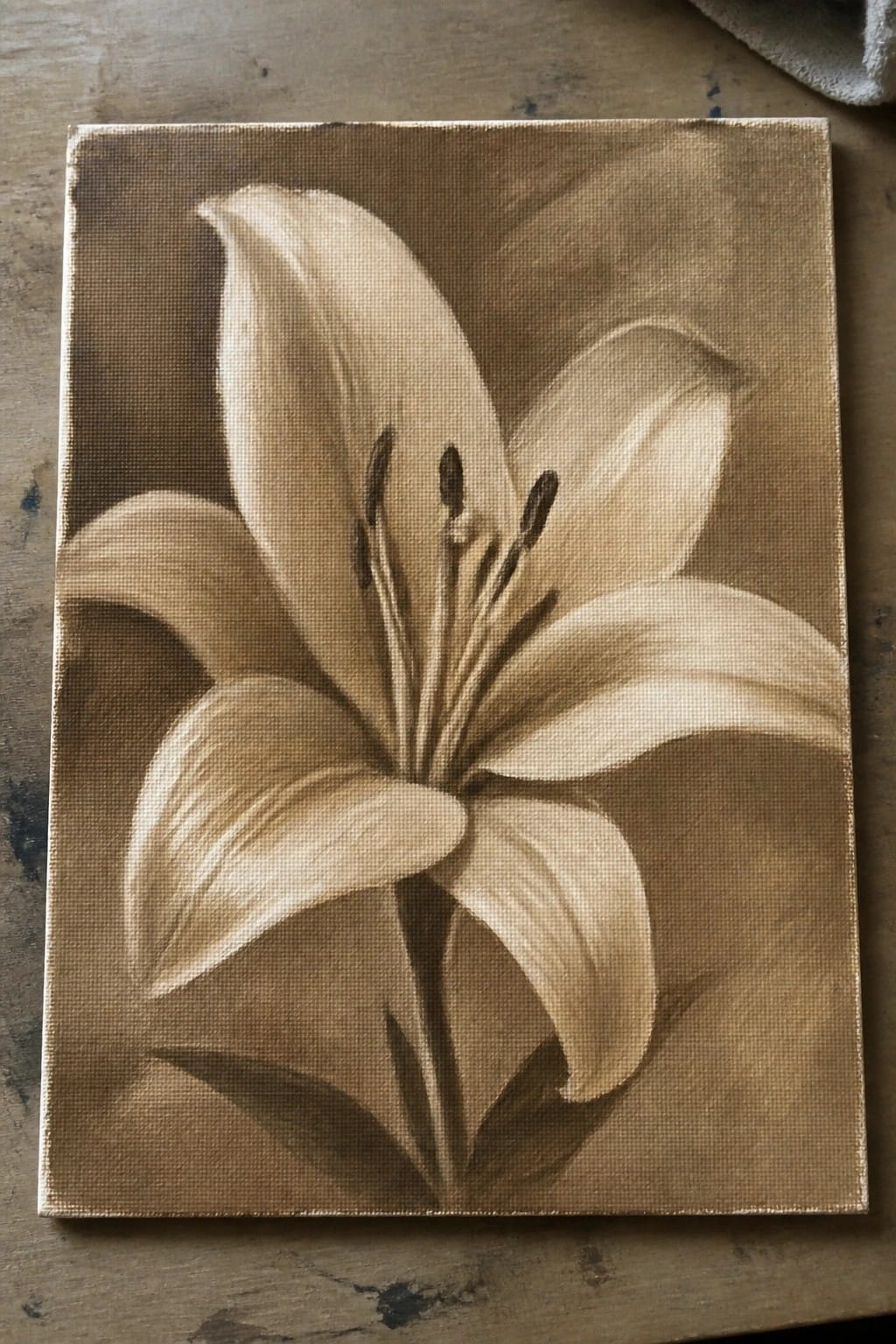 Sepia-toned painting of a blooming lily with dark stamens on canvas