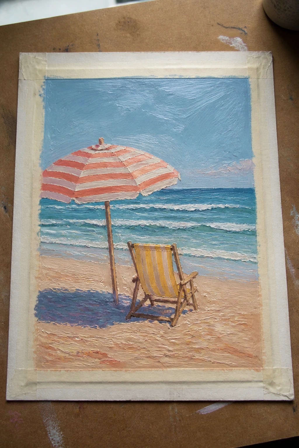 Oil painting of red-striped umbrella and yellow chair on sandy beach by blue ocean.
