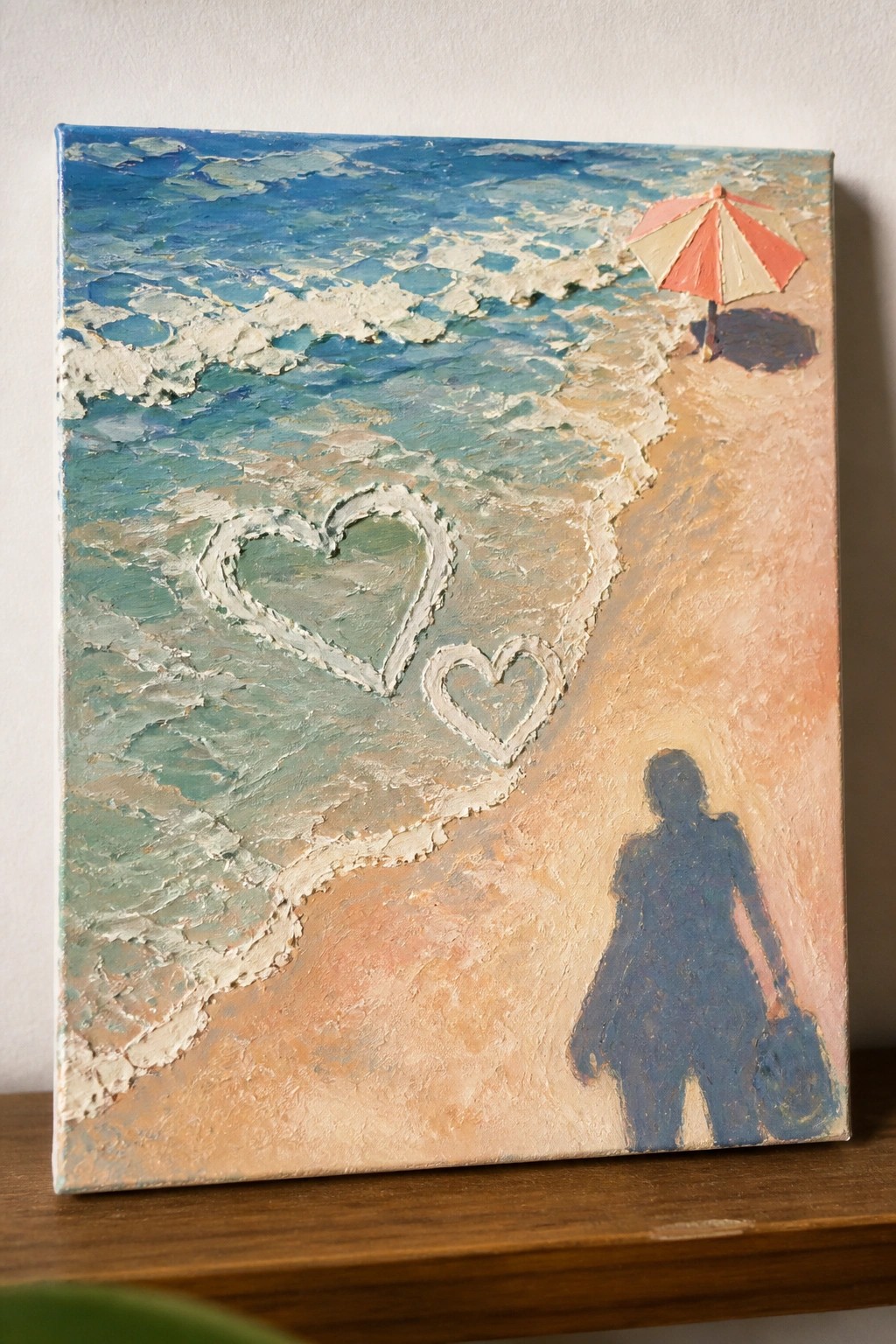 Thickly textured beach painting with heart shapes in surf, umbrella, and silhouetted figure.