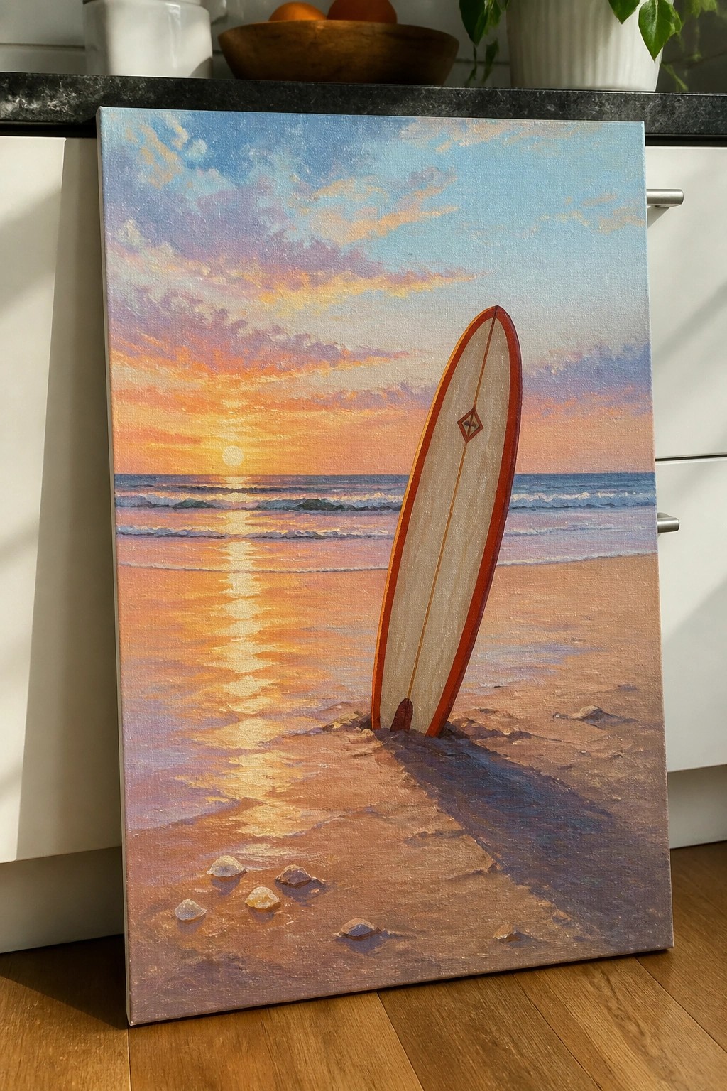 Surfboard upright in sand on beach at colorful ocean sunset with waves