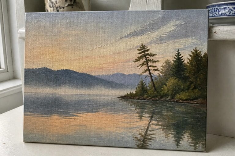 19 Beautiful Landscape Oil Painting Ideas Using Mountains, Lakes, and Forests Serene canvas painting of misty mountains reflected in a lake with pine trees at sunset.