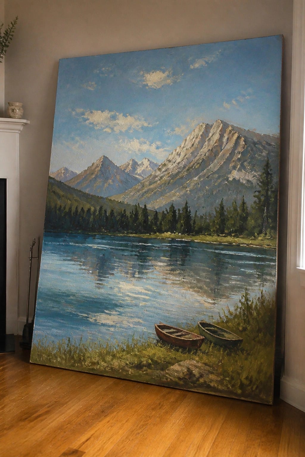 Large landscape painting of snow-capped mountains, blue lake, and two rowboats on shore