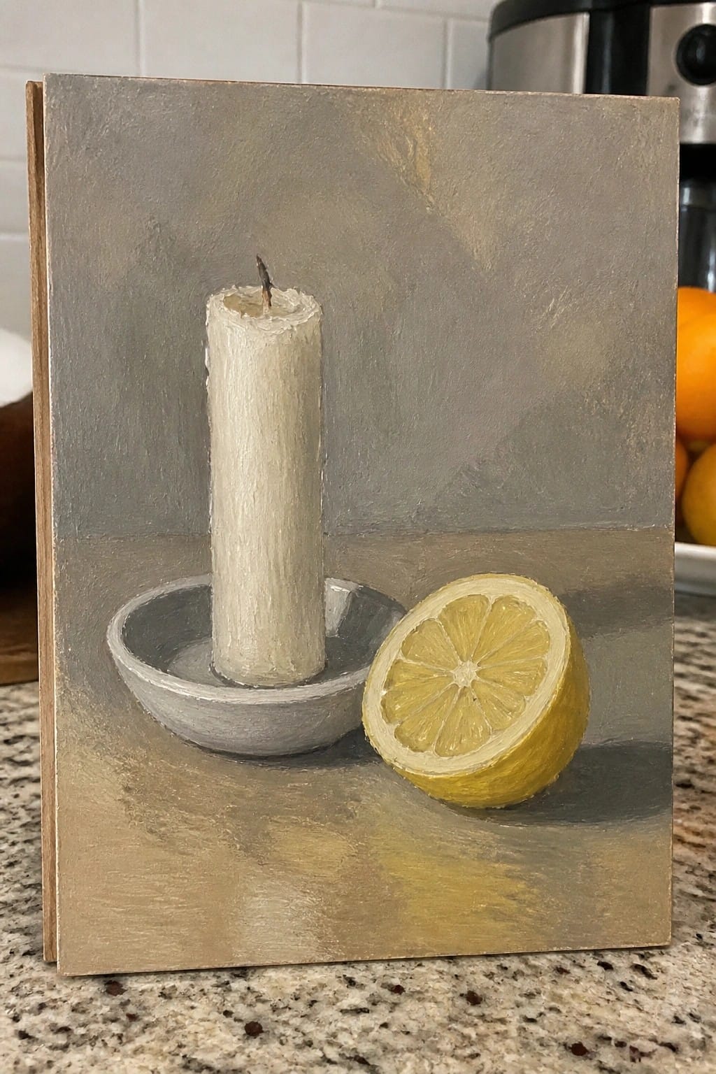Painting of white candle in gray dish beside halved yellow lemon on muted background.