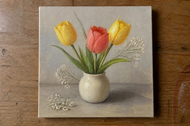 19 Colorful Floral Still Life Oil Painting Ideas Built Around Vases and Bouquets Three tulips in a beige vase on a wooden surface