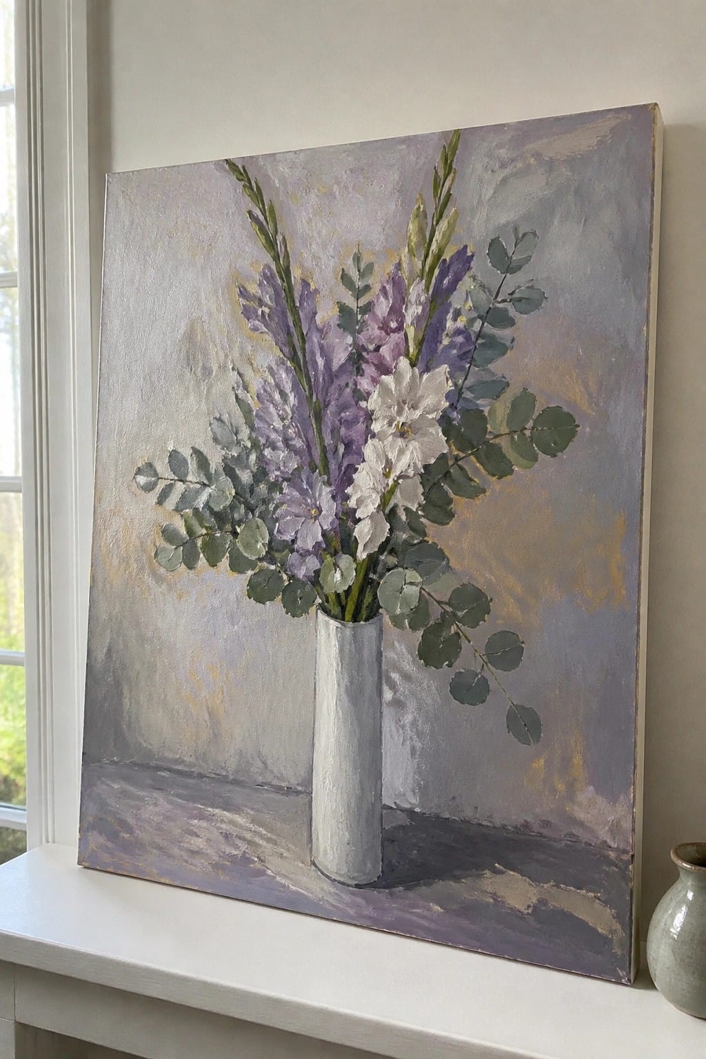 Impressionistic painting of purple and white flowers with eucalyptus in white vase on windowsill