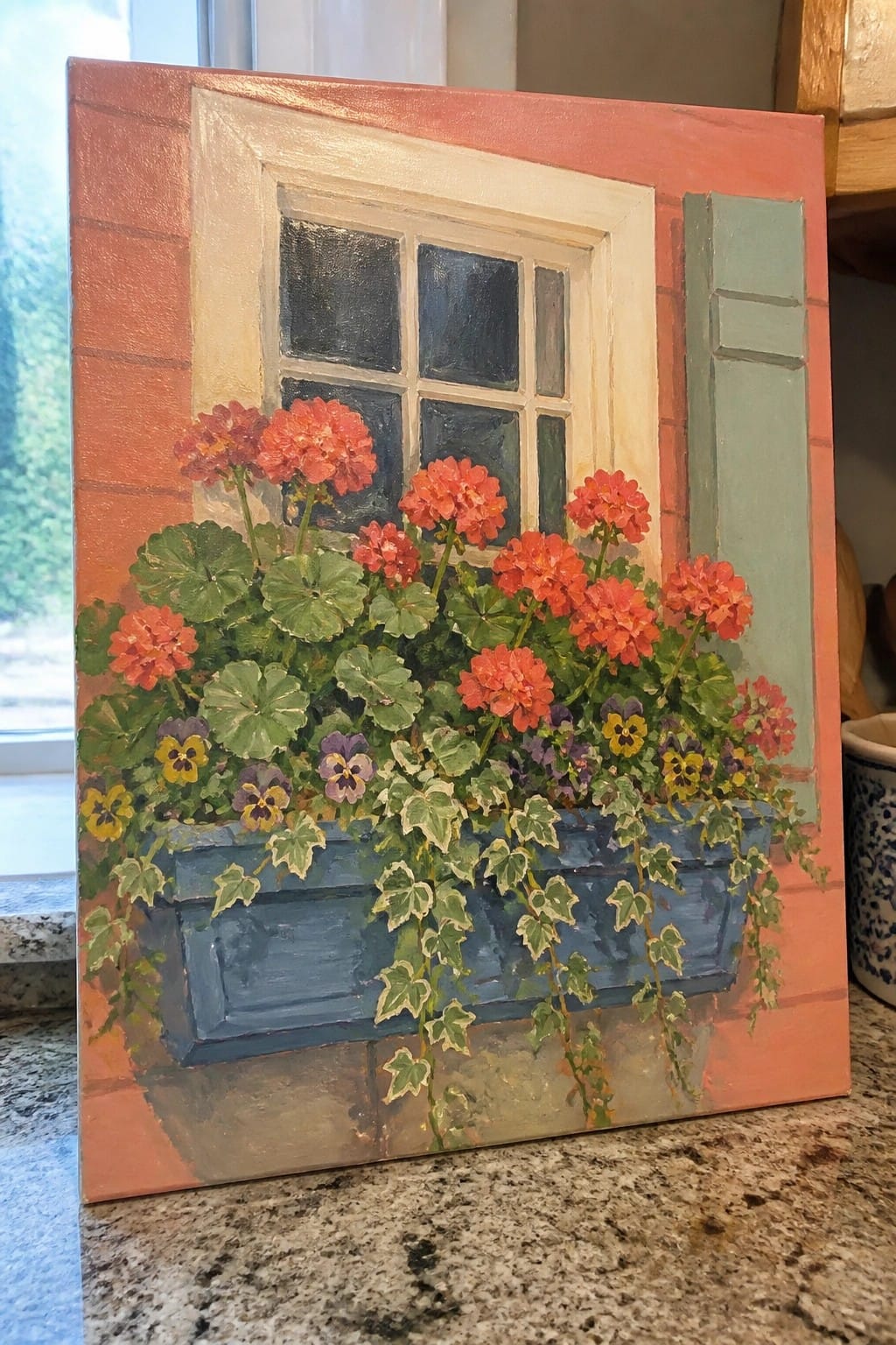 Vibrant painting of red geraniums in blue window box with trailing ivy on orange wall.