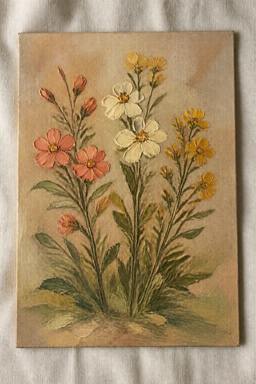 Painting of coral pink, white, and yellow flowers with green stems and leaves on canvas