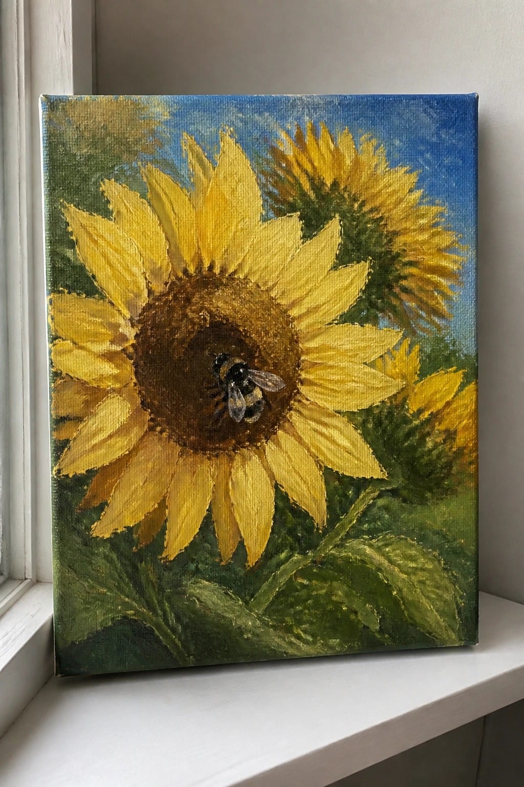 Oil painting of a yellow sunflower with a bumblebee on its brown center under blue sky