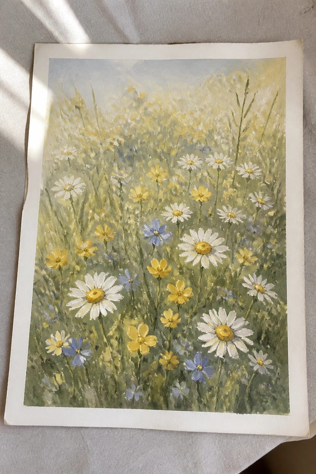 Impressionistic meadow painting with white daisies, yellow blooms, and blue wildflowers in green grass.