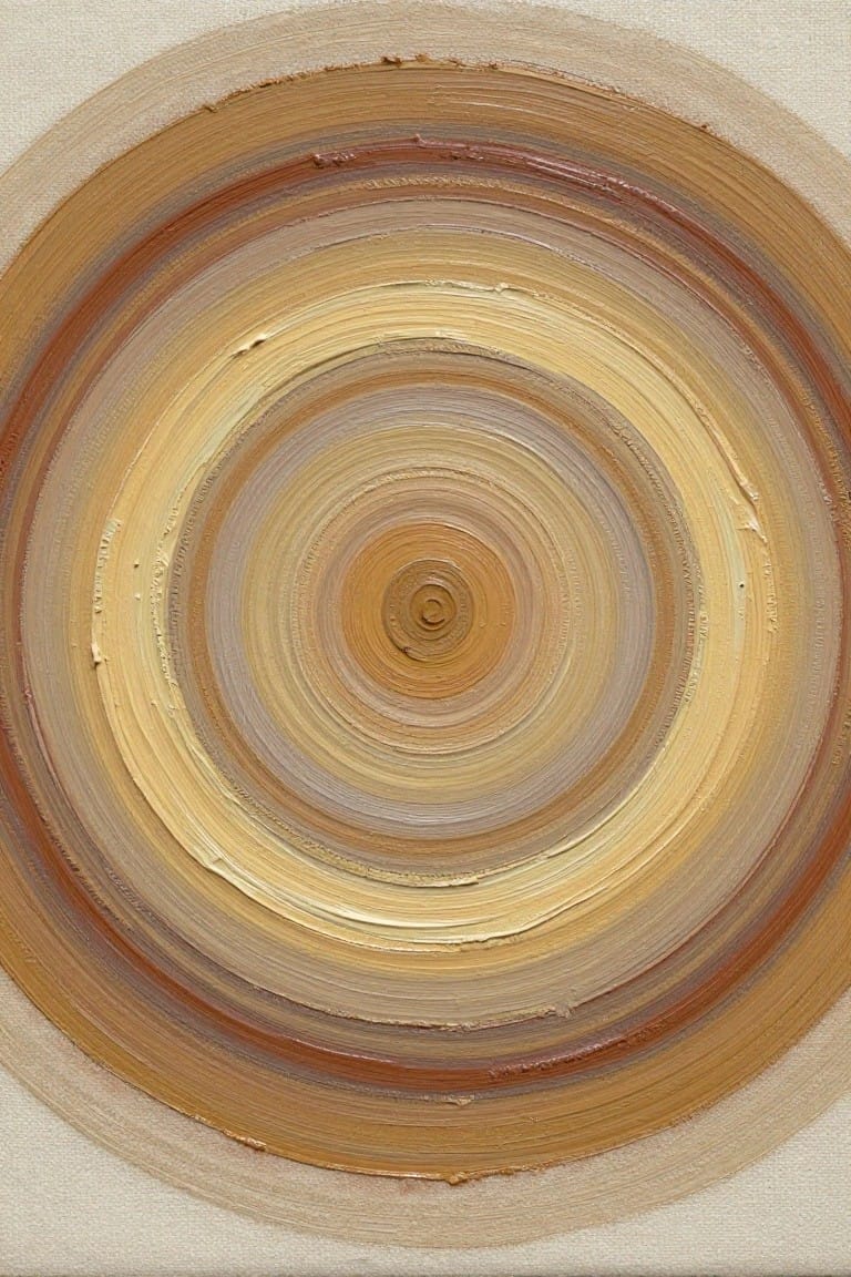 Concentric circles in swirling brushstrokes of brown, yellow, orange, and beige on canvas.