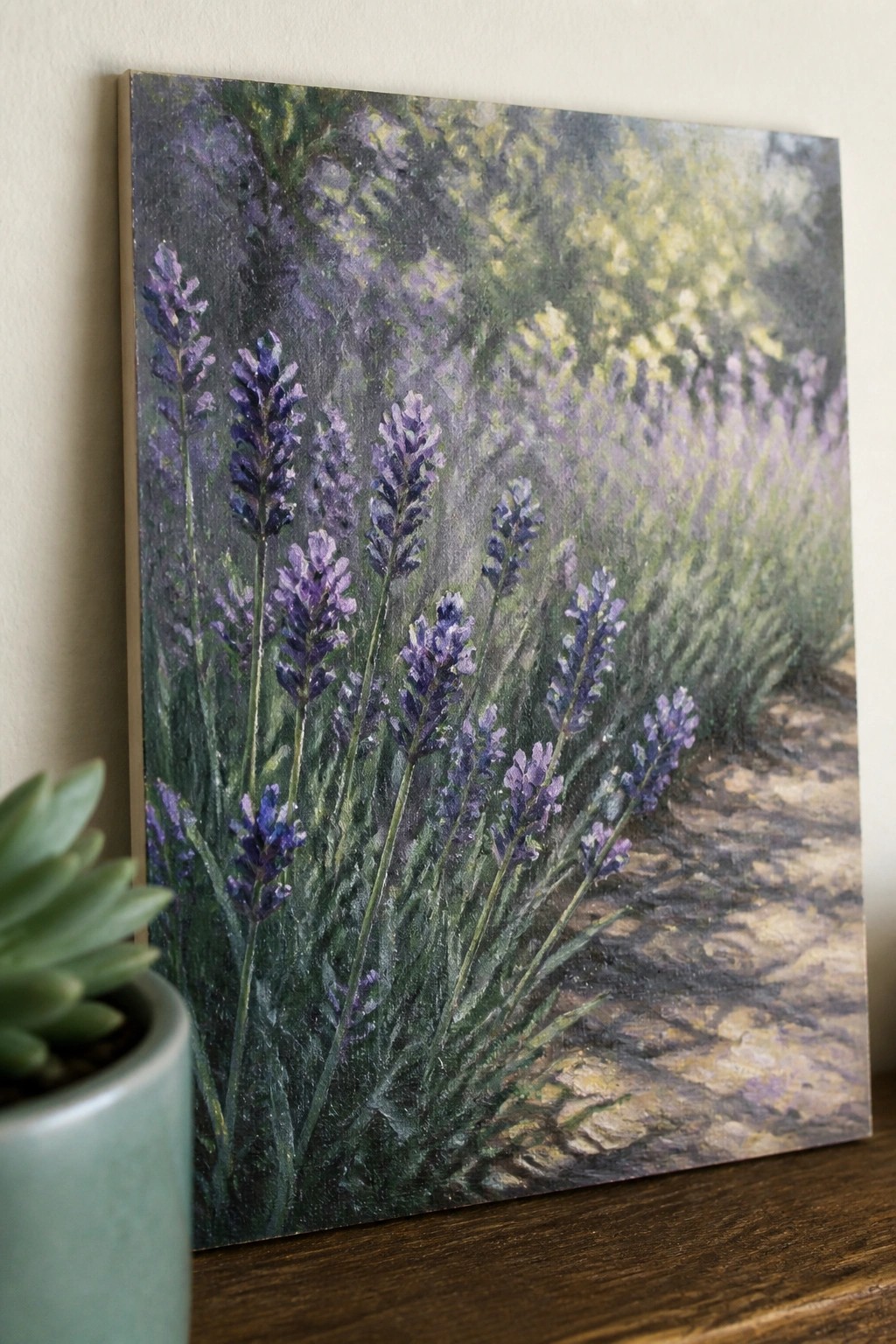 Canvas painting of purple lavender flowers beside potted succulent on wood.