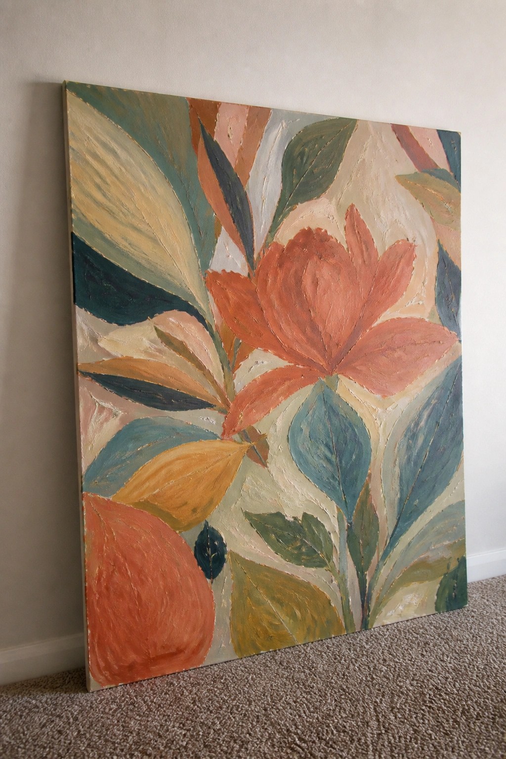 Abstract floral painting with large orange flower and multicolored leaves on canvas