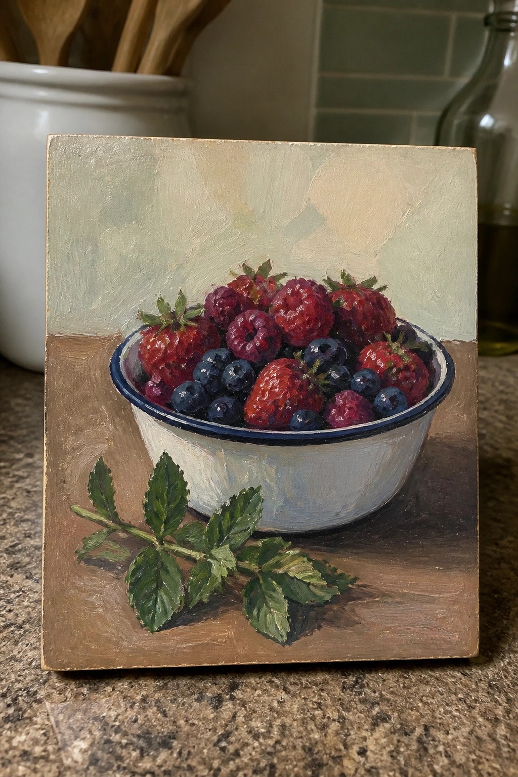Oil painting of strawberries, raspberries, and blueberries in a white bowl with mint leaves