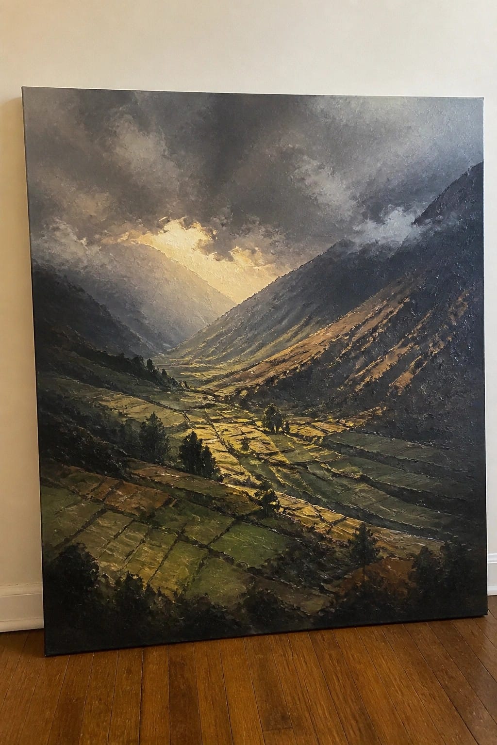 Dramatic oil painting of sunlit terraced valley fields beneath stormy mountain clouds