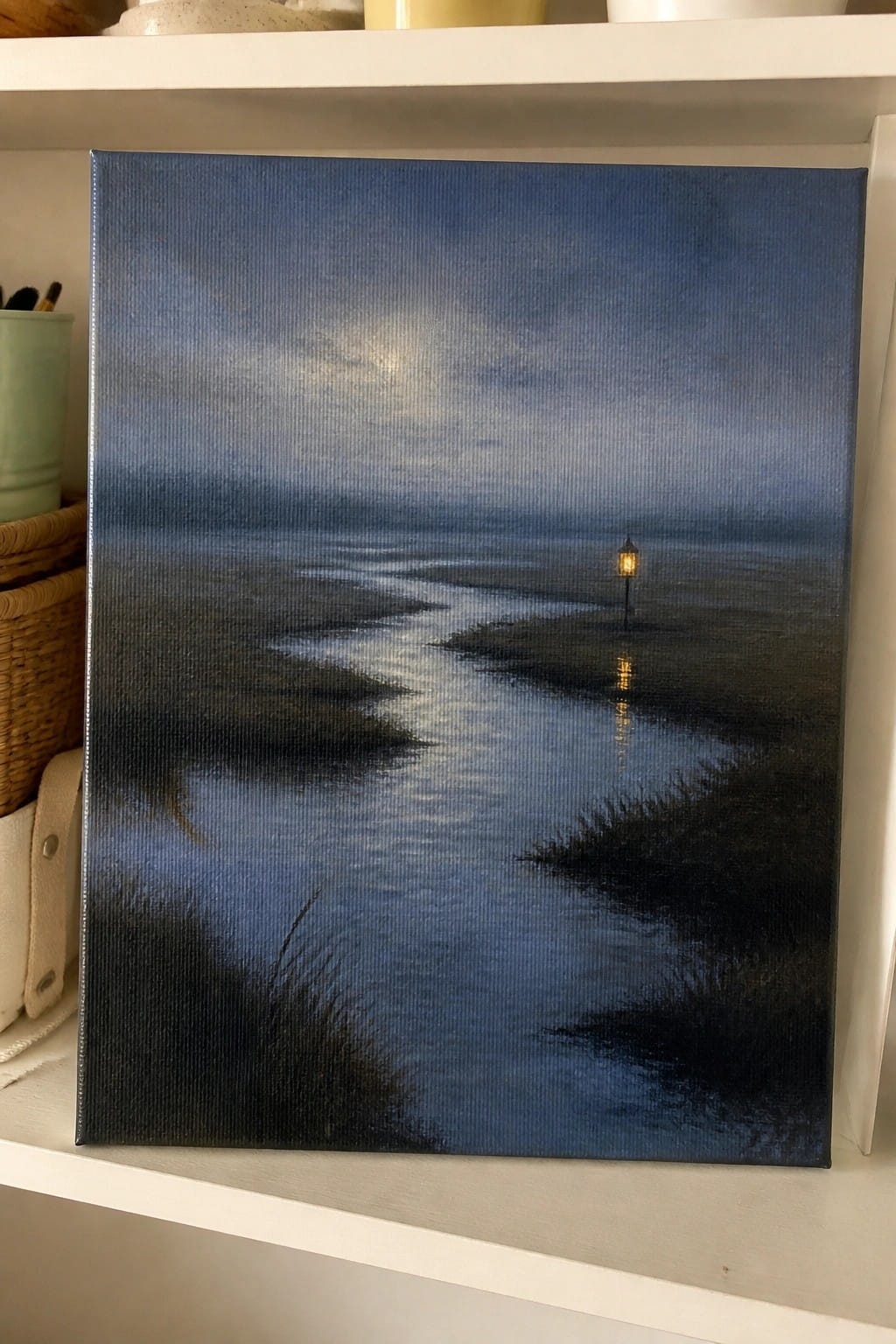 Nighttime oil painting of moonlit river with glowing lantern reflecting on water at night