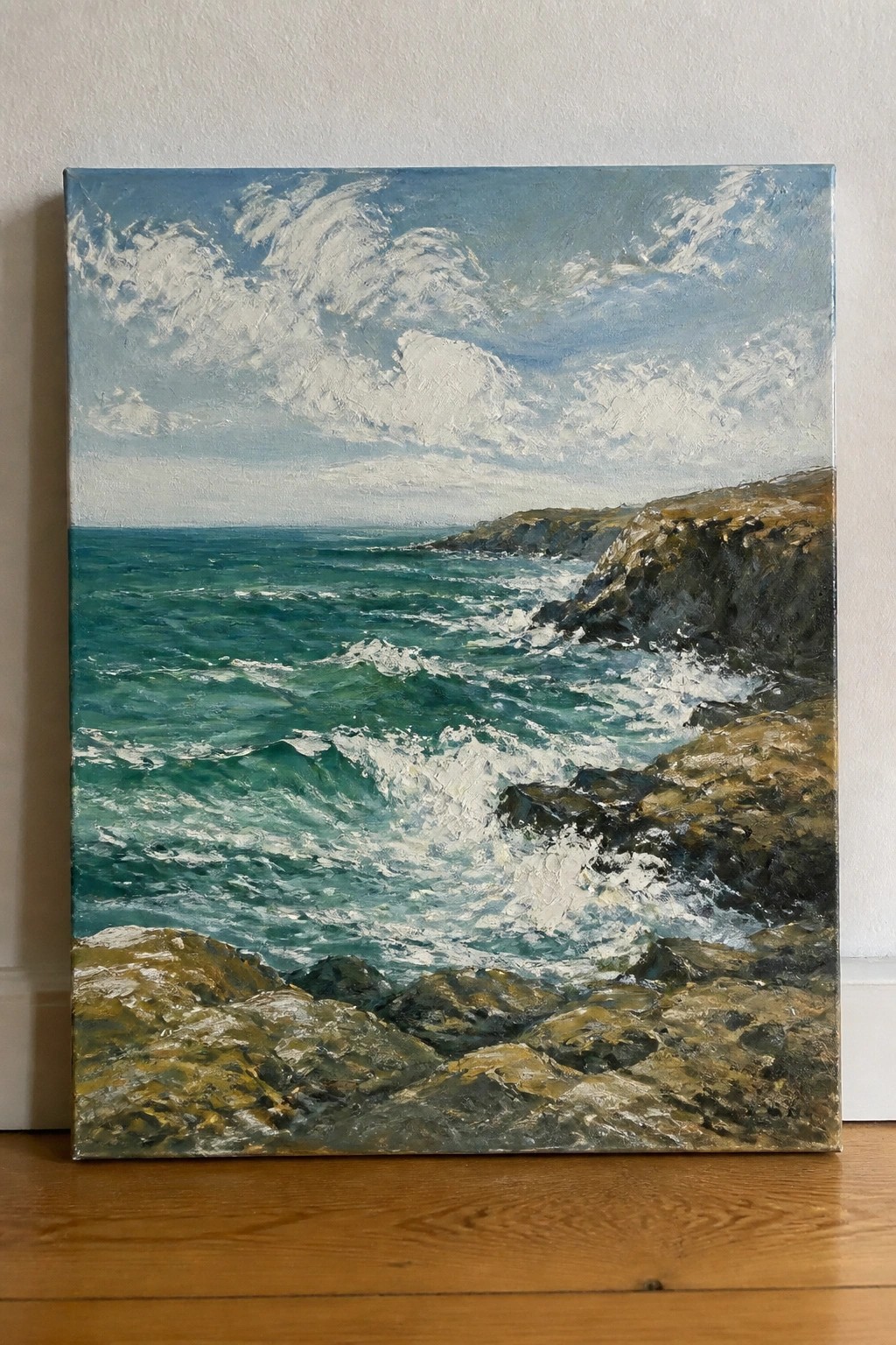 Oil painting of green waves crashing on rocky cliffs under cloudy blue sky.