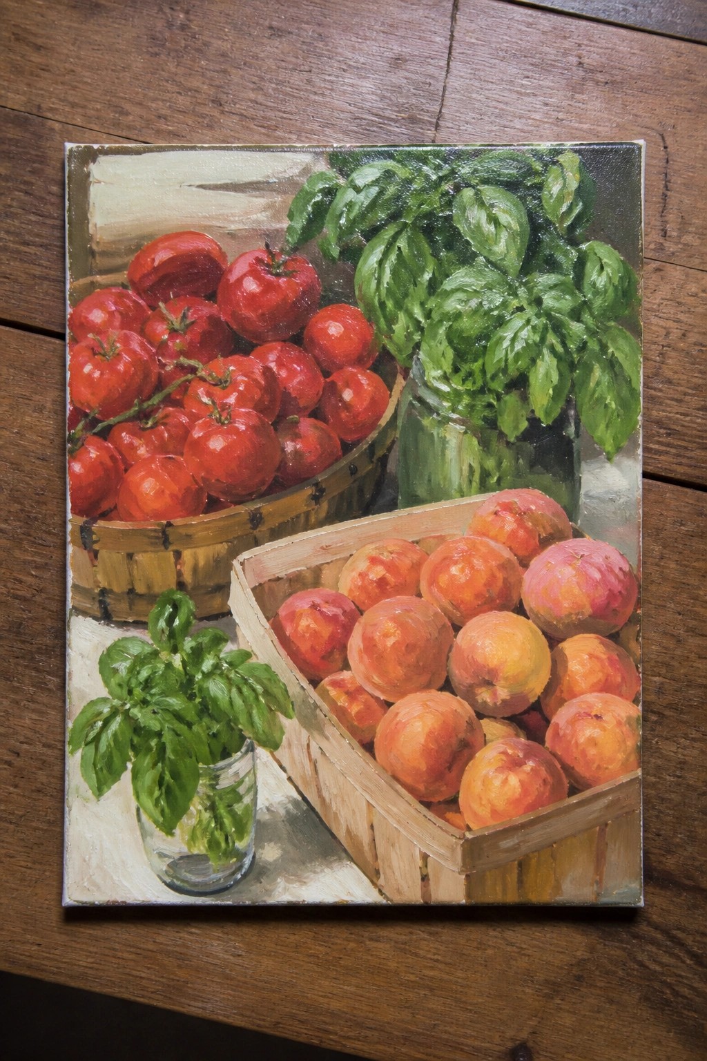 Realistic painting of tomatoes in a basket, peaches in a crate, and basil in jars.