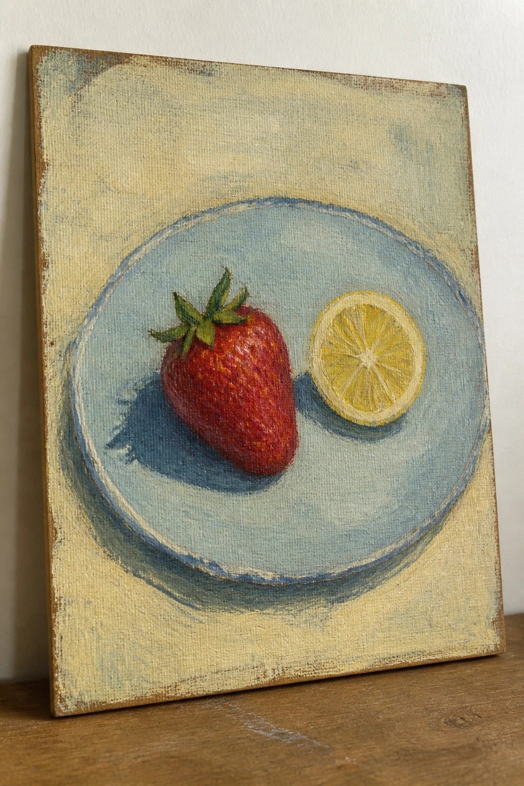 Still life painting of red strawberry and lemon slice on blue plate with shadow