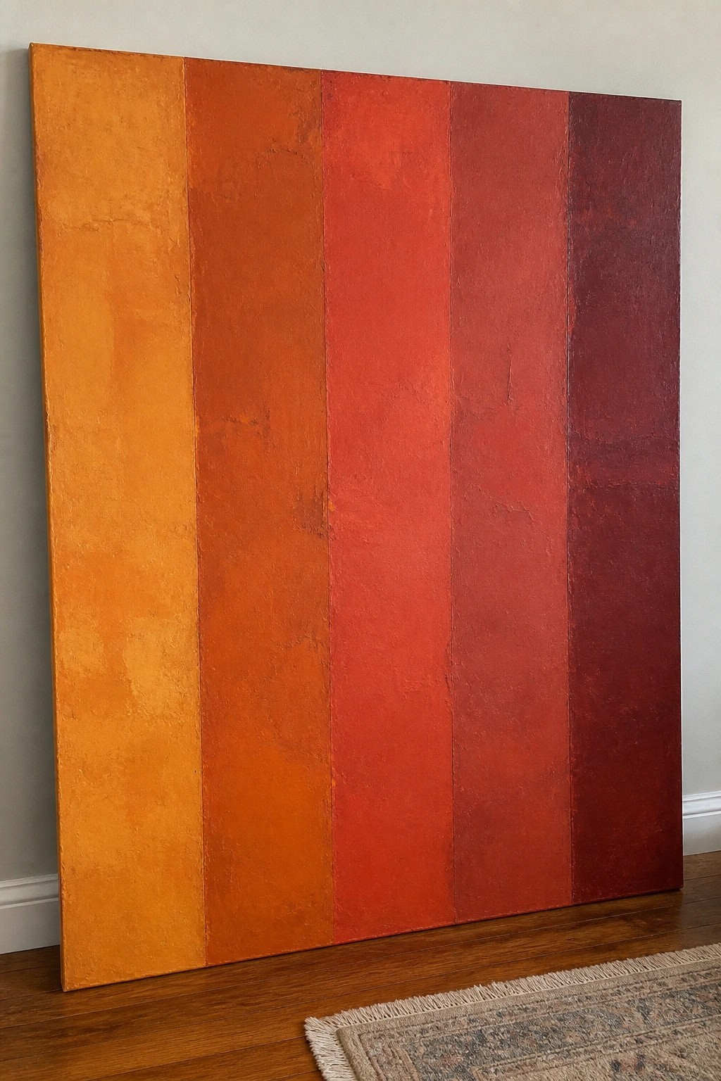 Large abstract oil painting with vertical stripes shifting from orange to deep red, showing textured paint on each band.