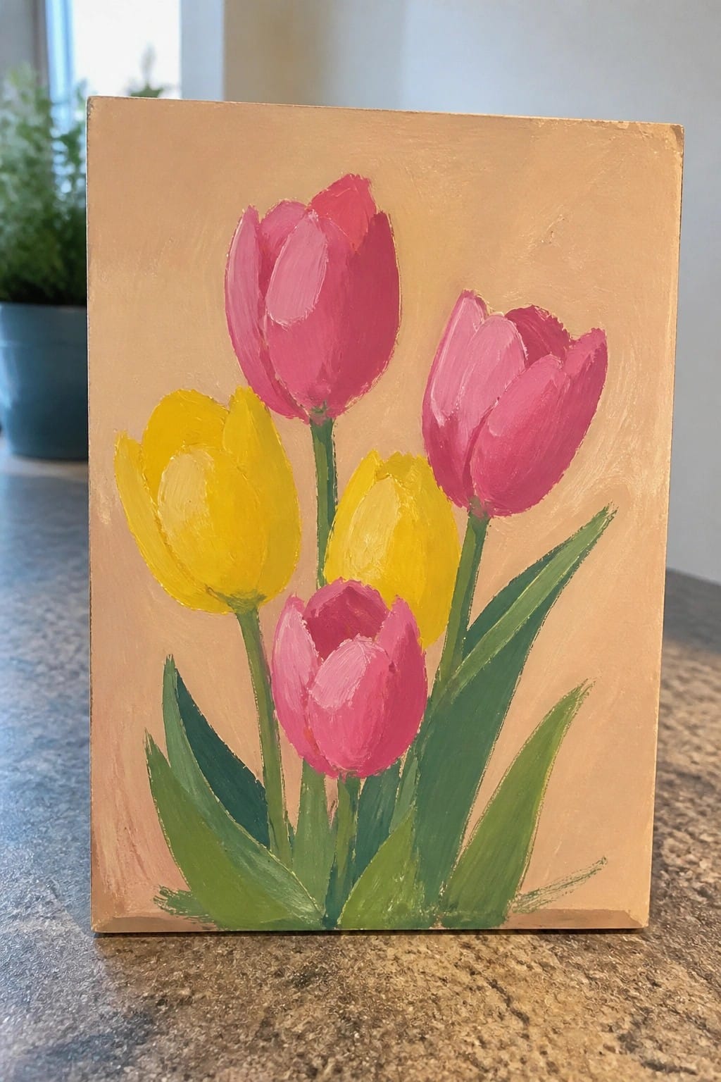 Vibrant painting of pink and yellow tulips with green leaves on beige background