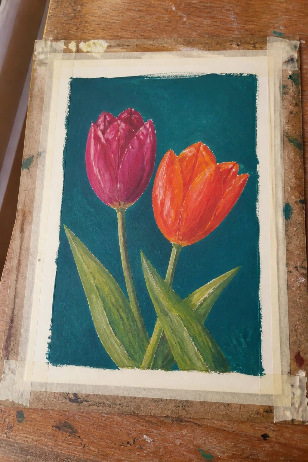 Two oil-painted tulips, one purple and one orange, with green leaves on a teal background.