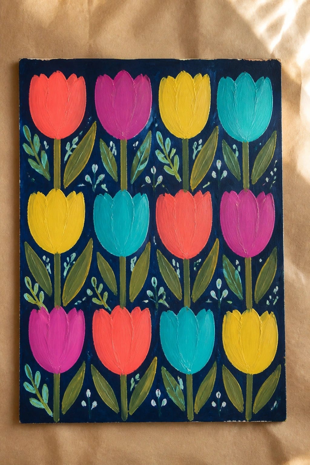 Colorful tulips in bright hues painted in rows on dark blue background