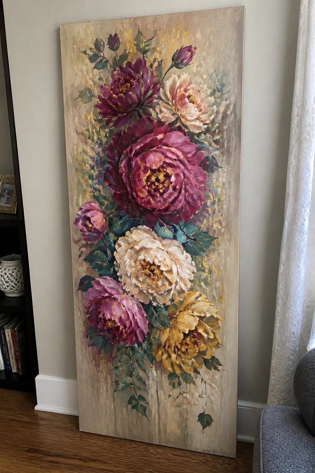 Tall vertical painting of vibrant peonies in purple, white, and yellow with green leaves.