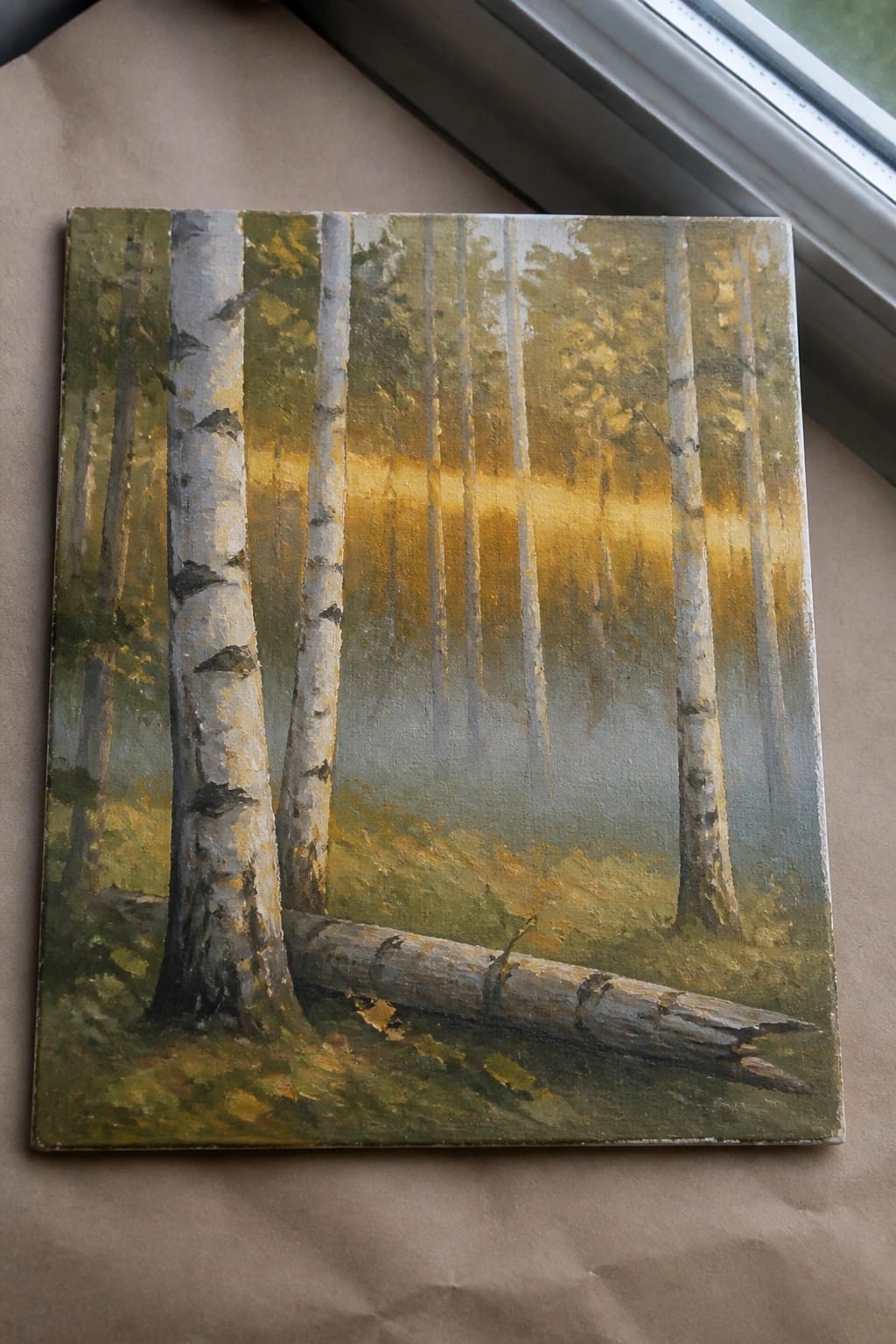 Oil painting of misty birch forest with golden sunlight and fallen log.