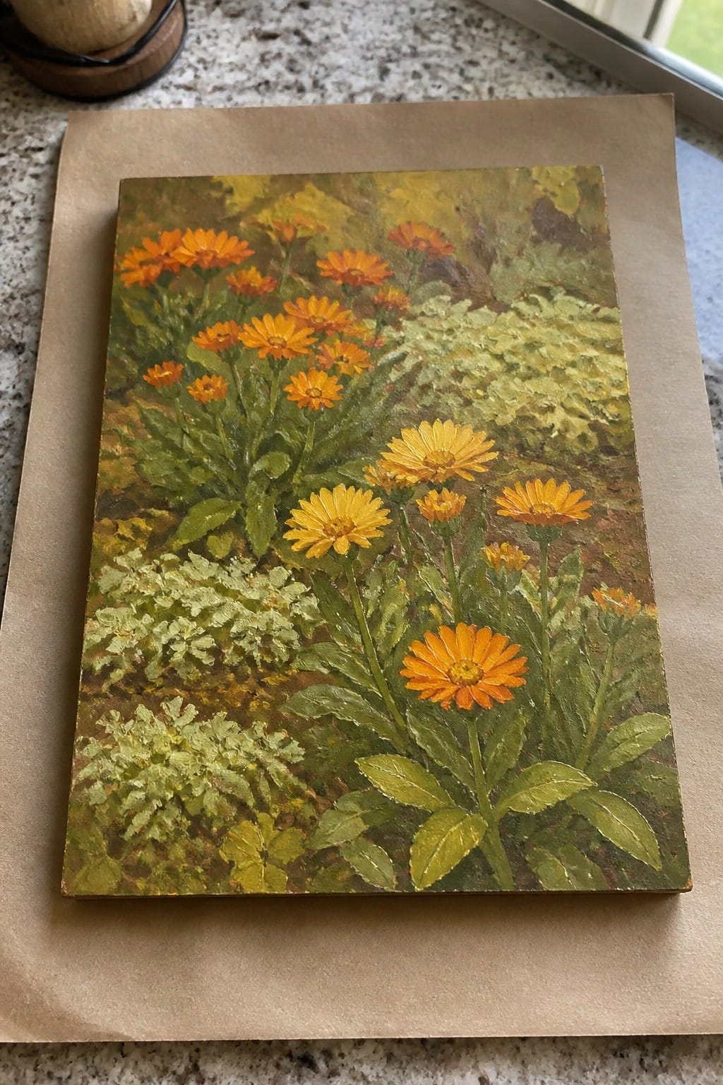 Oil painting of orange and yellow flowers with green leaves on a brown paper surface.