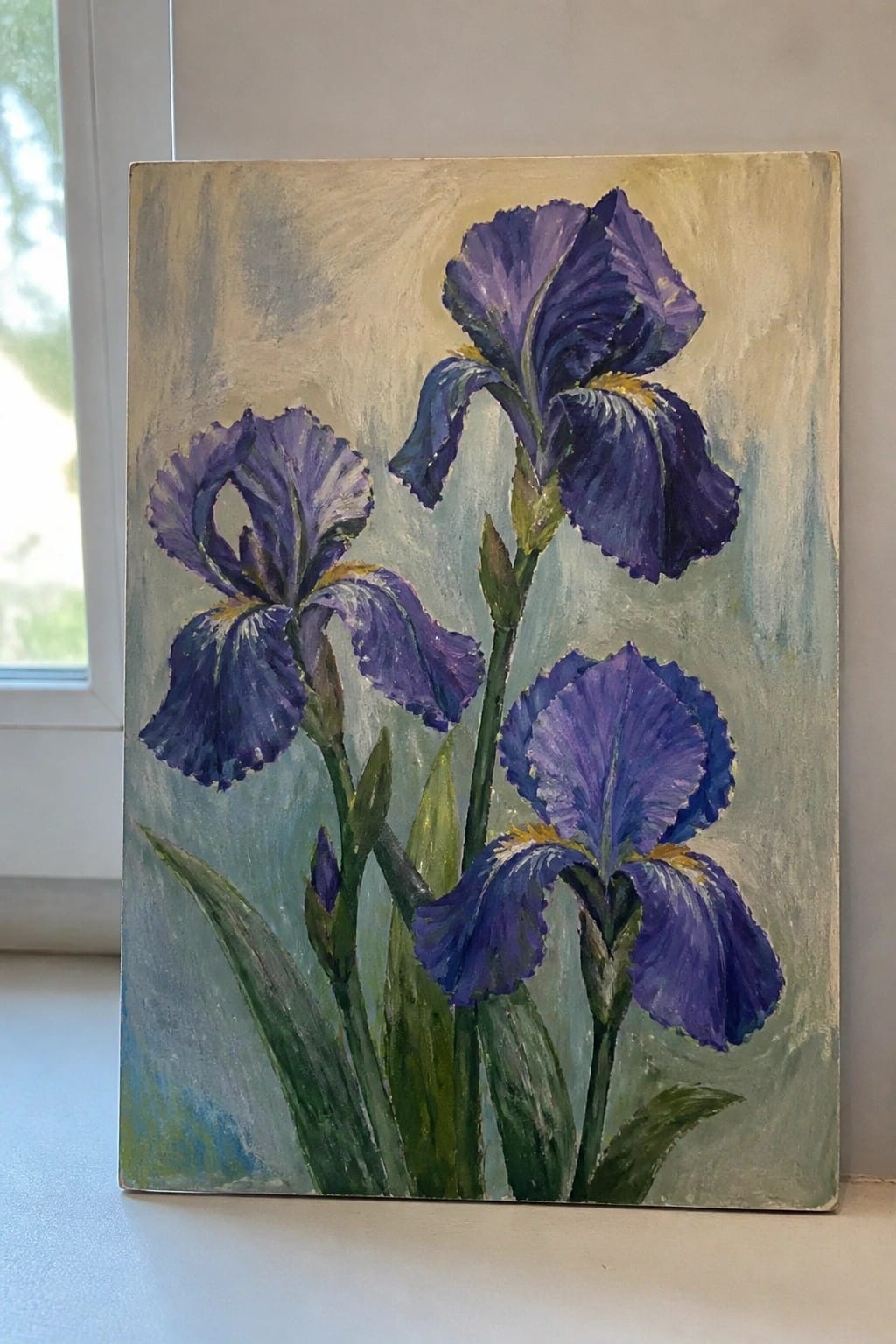 Three purple irises with yellow accents amid green stems and leaves on canvas