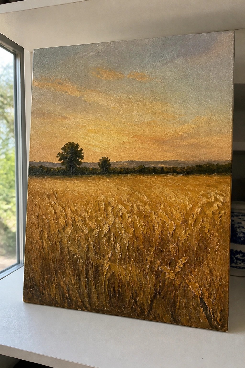 Golden wheat field painting with textured strokes under vibrant orange sunset sky