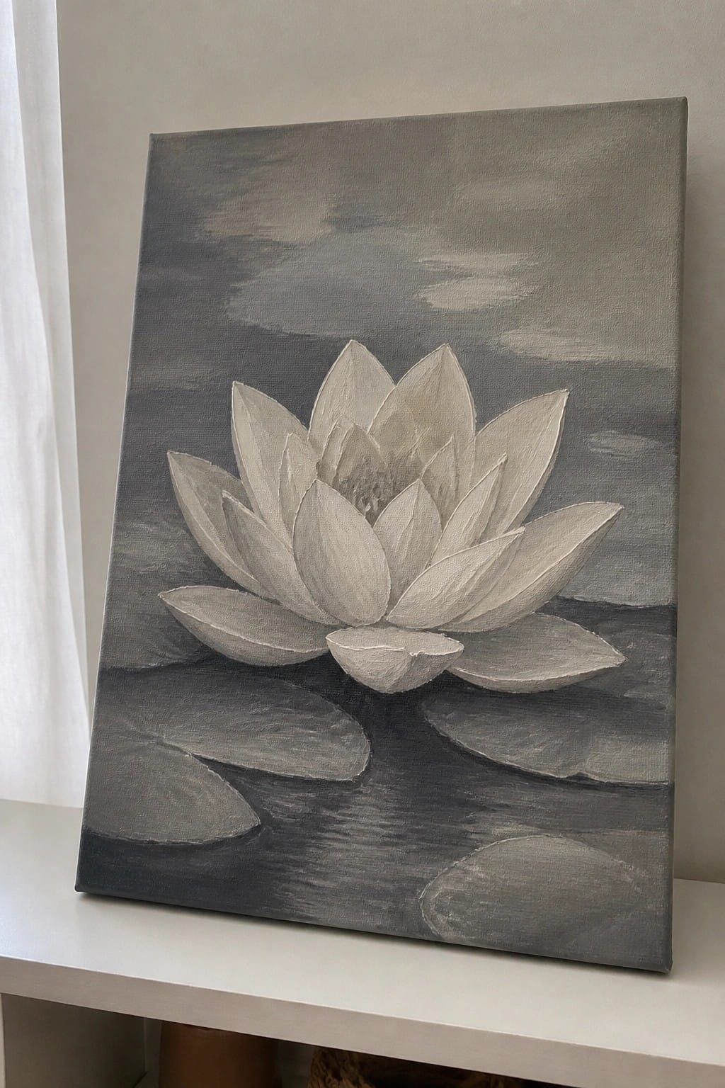 Grayscale lotus flower painting on canvas with lily pads in dark water
