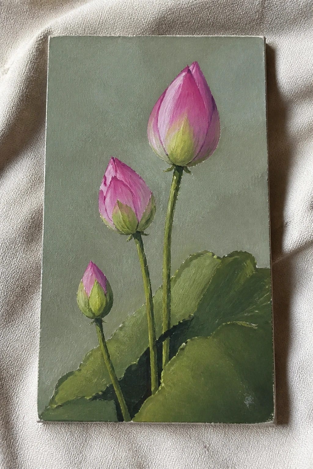 Three pink lotus buds on green stems with broad leaves in painting