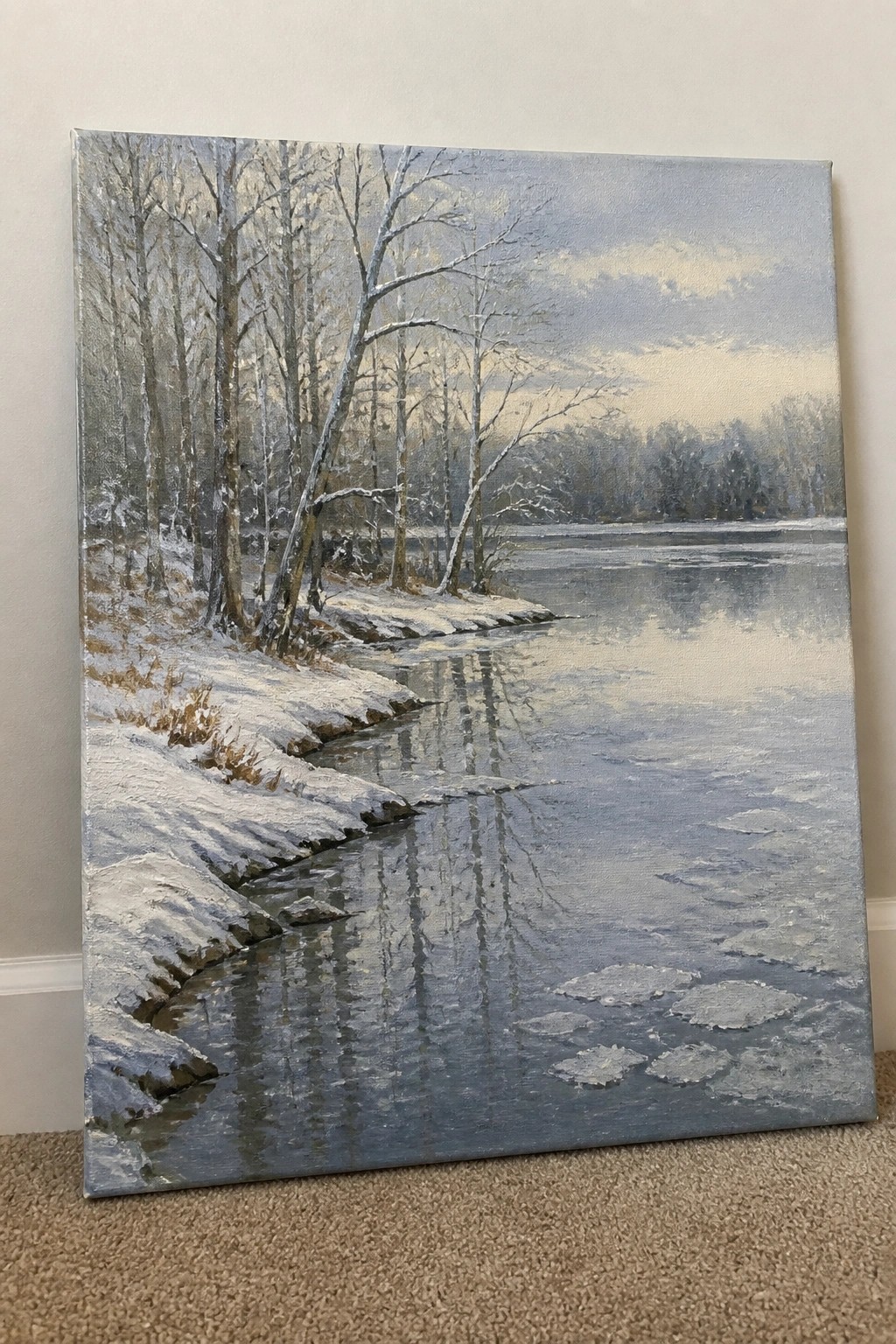 Realistic painting of snowy river with bare trees, ice floes, and reflections under gray sky
