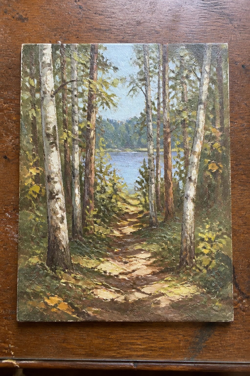 Winding dirt path through white birch trees leads to a blue lake, oil painting