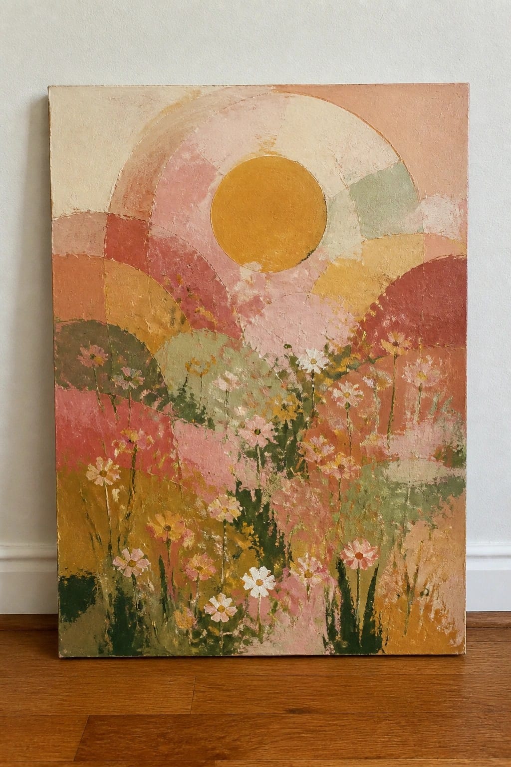 Abstract painting of golden sun over meadow of pink, white, and yellow wildflowers
